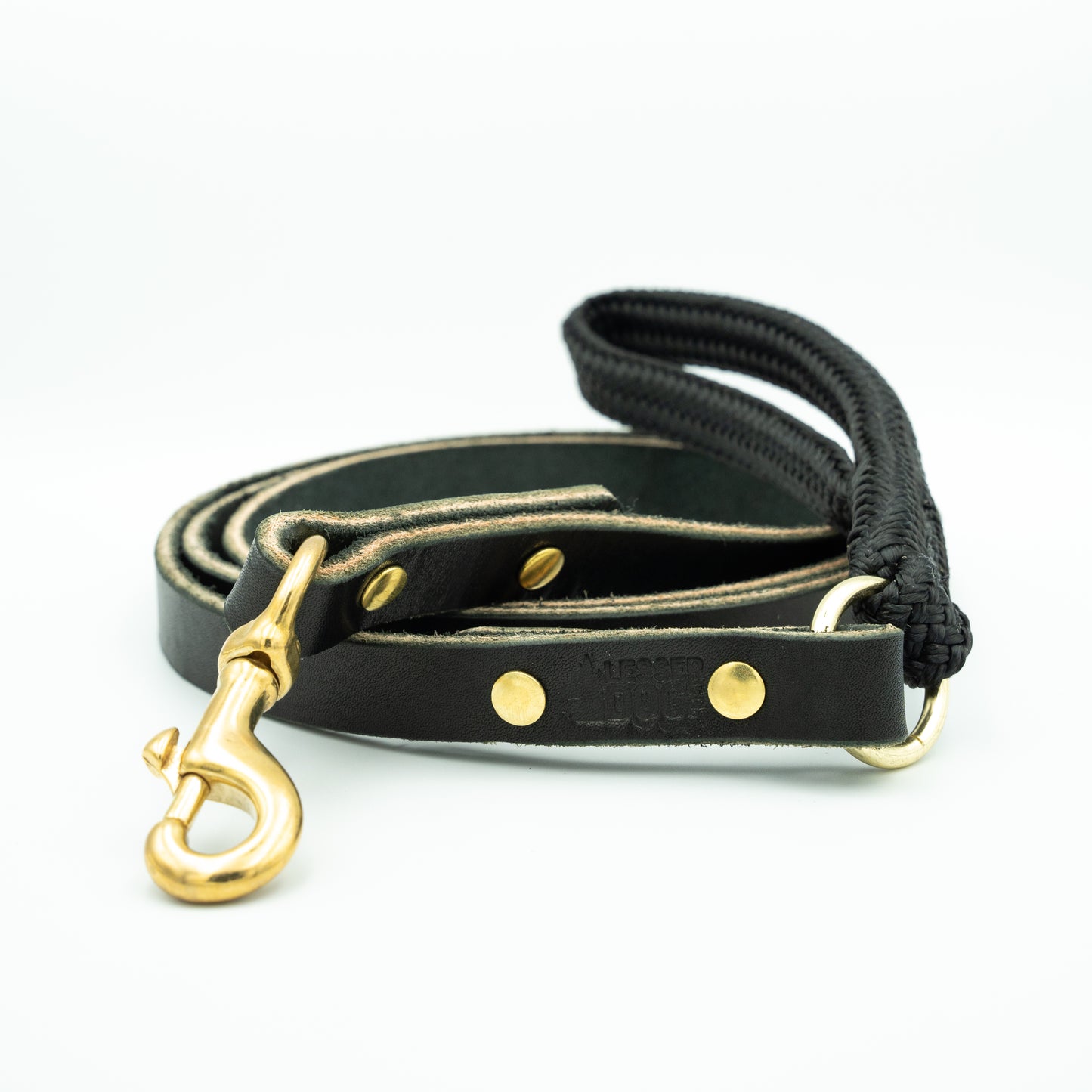 Black leather dog leash with gold hardware and black rope handle on a white background Eclipse