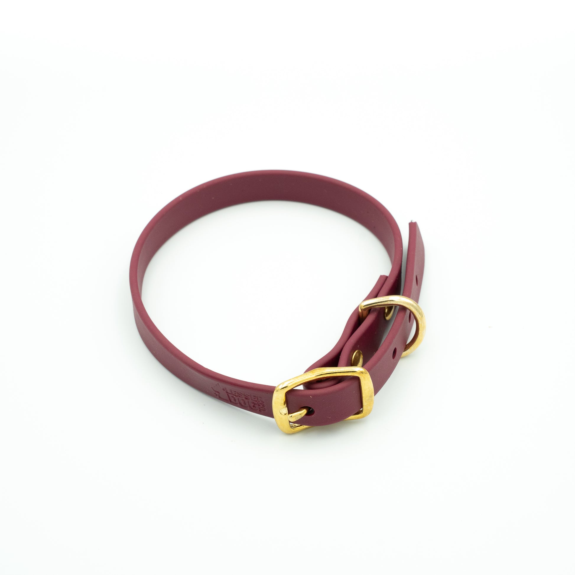 Maroon leather dog collar with a gold buckle on a white background Garnet