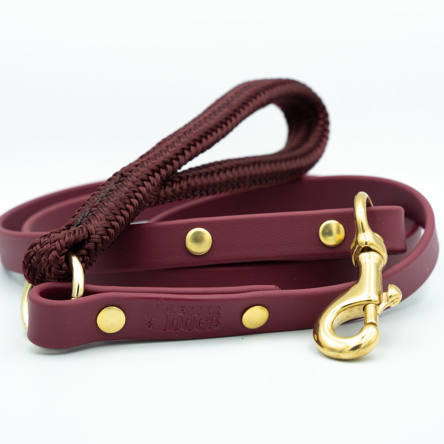 Maroon dog leash with gold hardware on a white background Garnet
